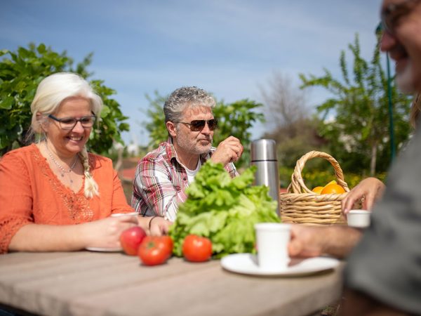 happy mature couple having dinner outside hgh anti aging dosage