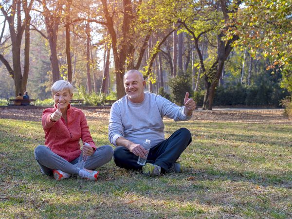 senior couple on the grass park benefits of hgh for men