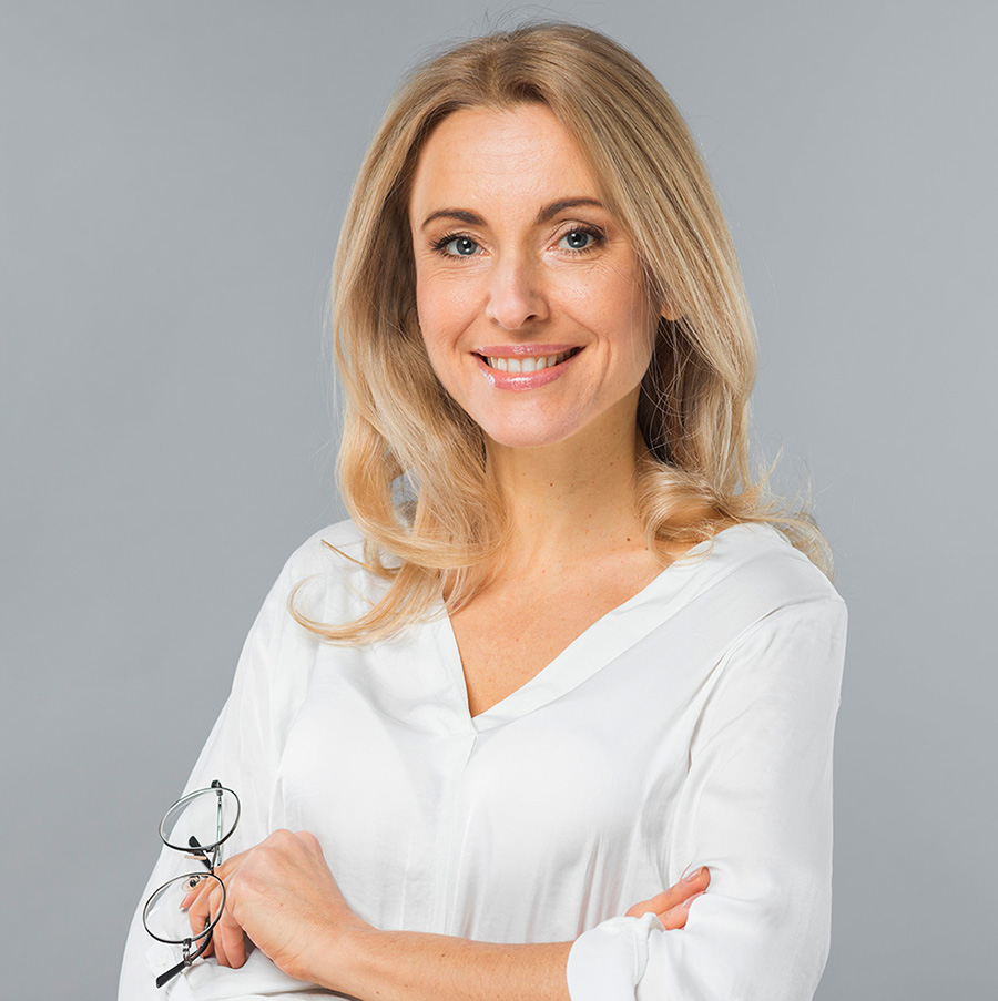 smiling woman holding glasses